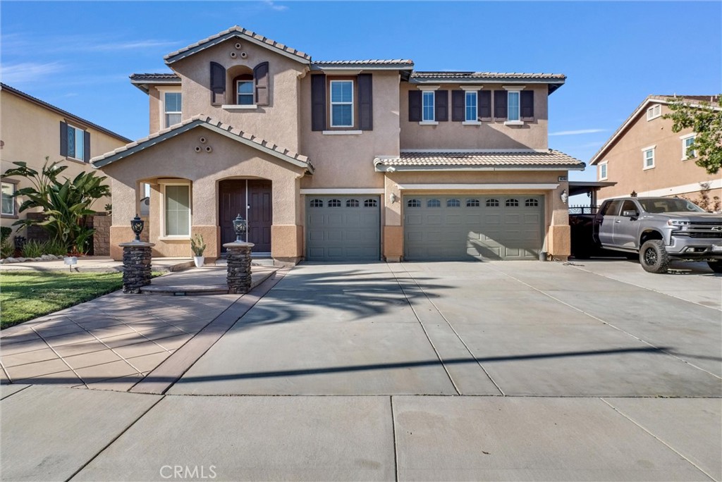 18388 Hidden Ranch Road Riverside, CA 92508 - Photo 2 of 49 a view of a white house with a large windows and a yard