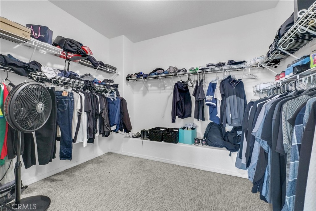 18388 Hidden Ranch Road Riverside, CA 92508 - Photo 27 of 49 a view of walk in closet with clothes and shoes