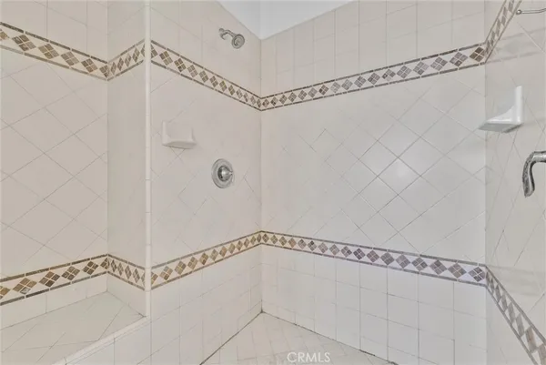 a bathroom with a shower and a shower
