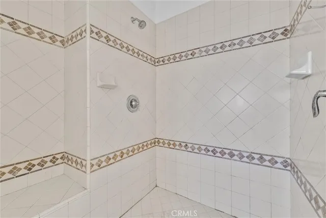 a bathroom with a shower and a shower
