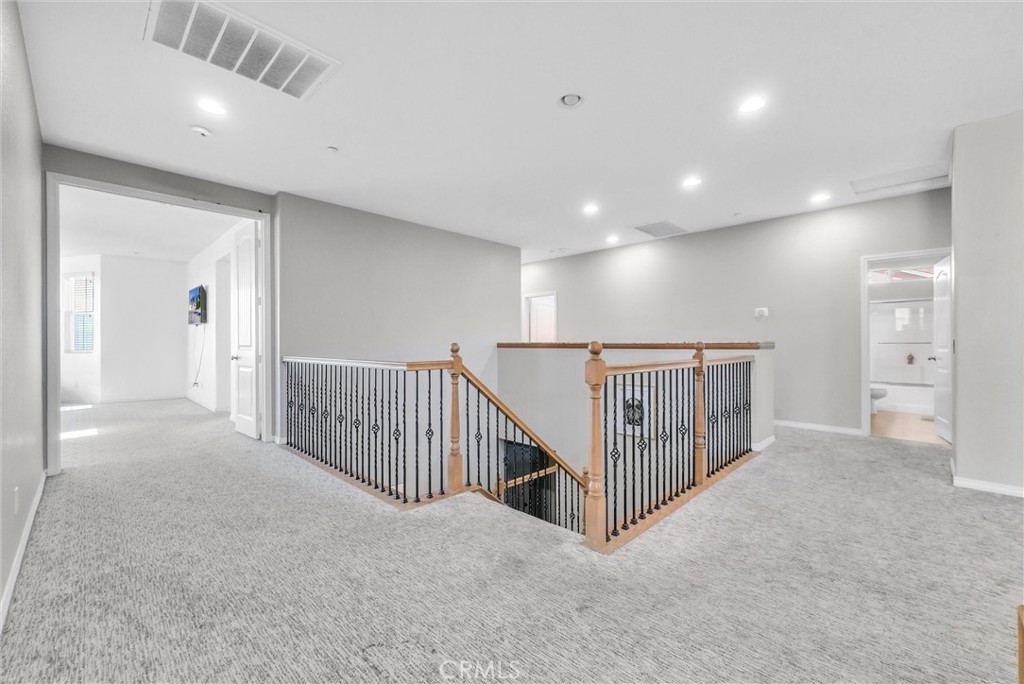 18388 Hidden Ranch Road Riverside, CA 92508 - Photo 30 of 49 a view of a hallway with entryway and stairs