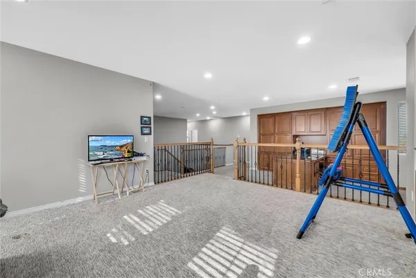 a view of a hallway with furniture