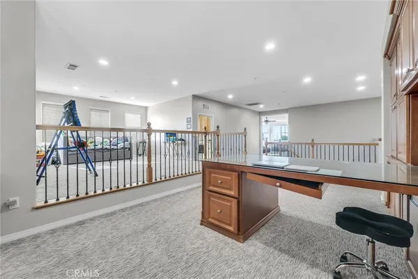 a view of a room with lots of white furniture