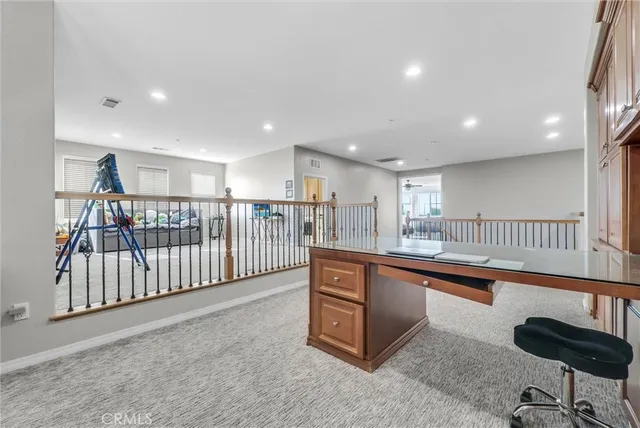 a view of a room with lots of white furniture