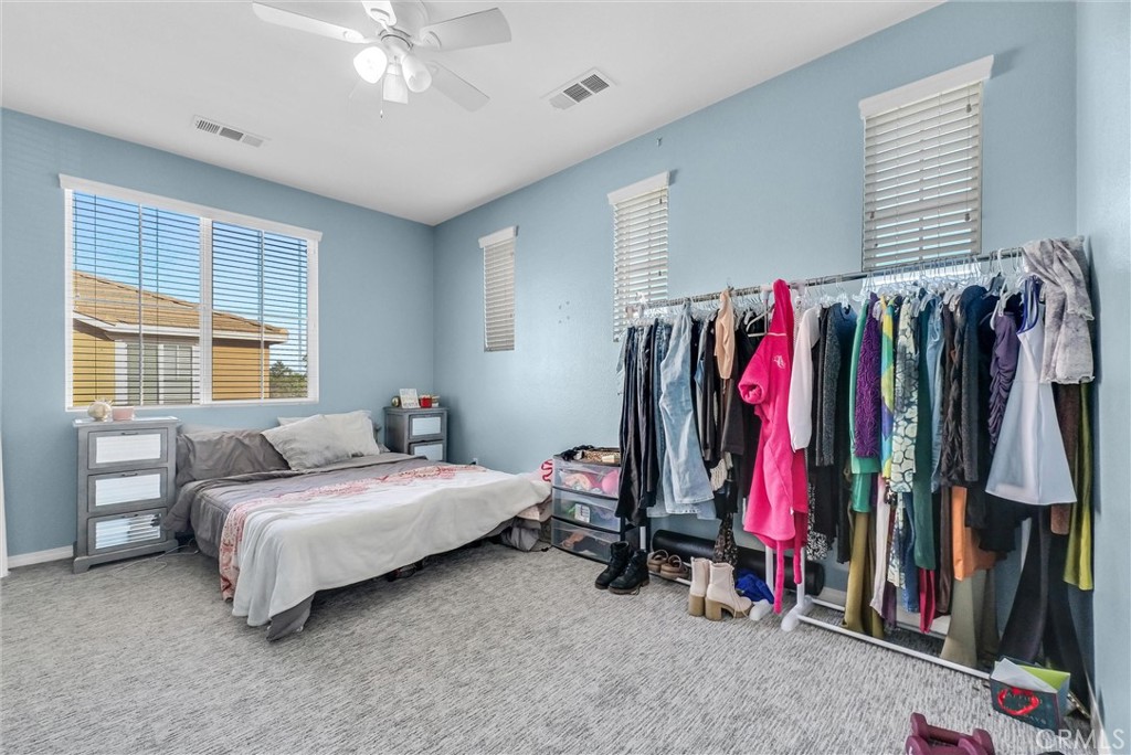 18388 Hidden Ranch Road Riverside, CA 92508 - Photo 38 of 49 a bed room with a bed and a window