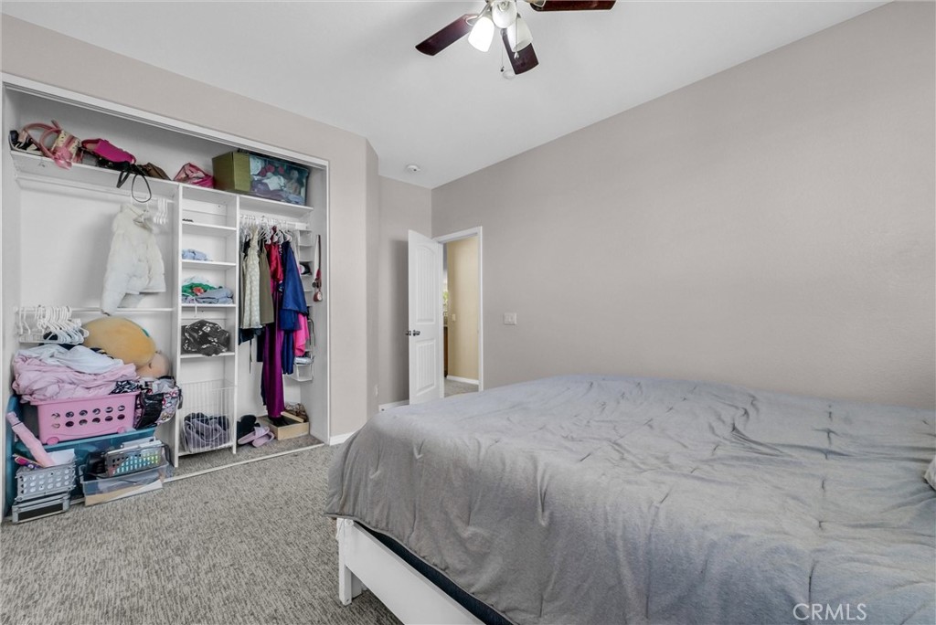 18388 Hidden Ranch Road Riverside, CA 92508 - Photo 43 of 49 a bedroom with a bed and a walk in closet