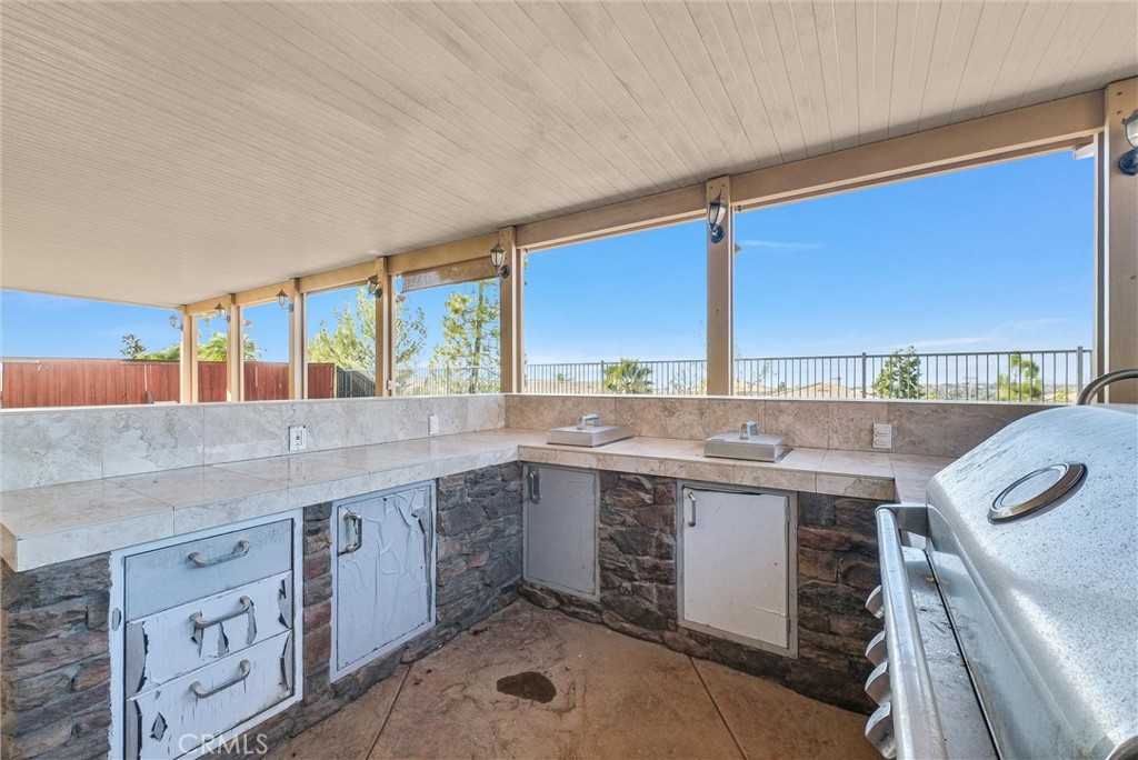 18388 Hidden Ranch Road Riverside, CA 92508 - Photo 46 of 49 a kitchen with a sink stove and cabinets