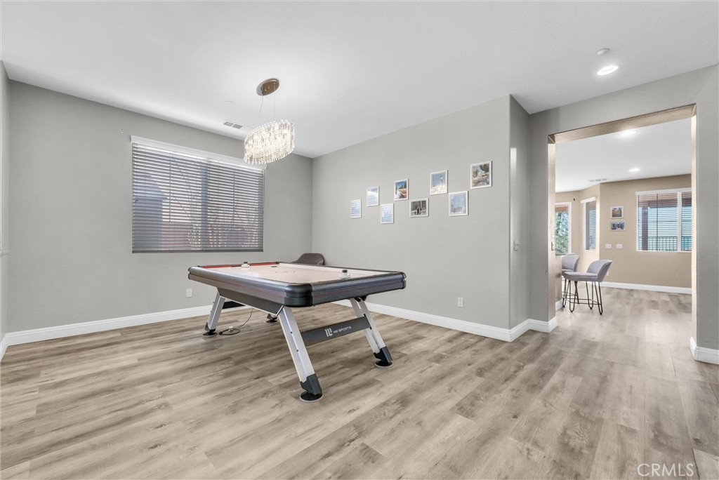 18388 Hidden Ranch Road Riverside, CA 92508 - Photo 7 of 49 a view of a workspace with furniture window and wooden floor