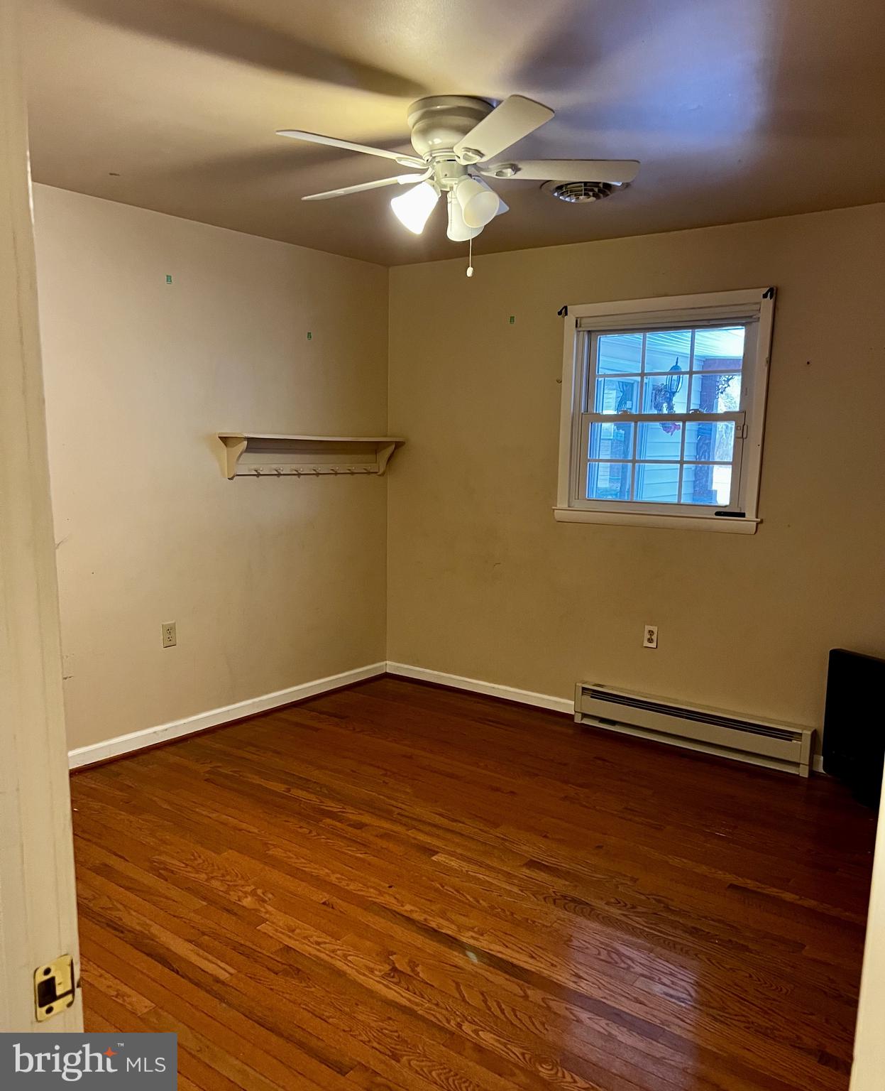 139 Carter Road Elkton, MD 21921 - Photo 11 of 27 a view of an empty room with wooden floor and a window