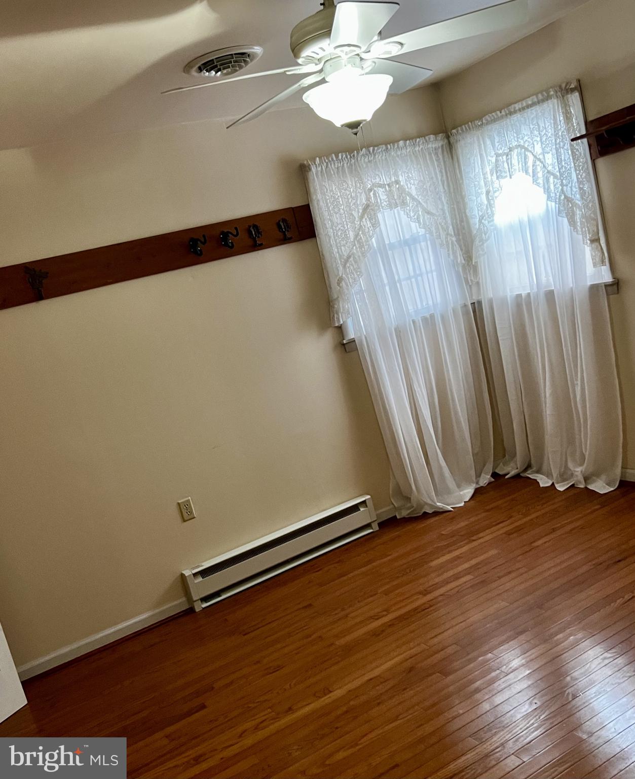 139 Carter Road Elkton, MD 21921 - Photo 12 of 27 a view of an empty room with wooden floor and a window