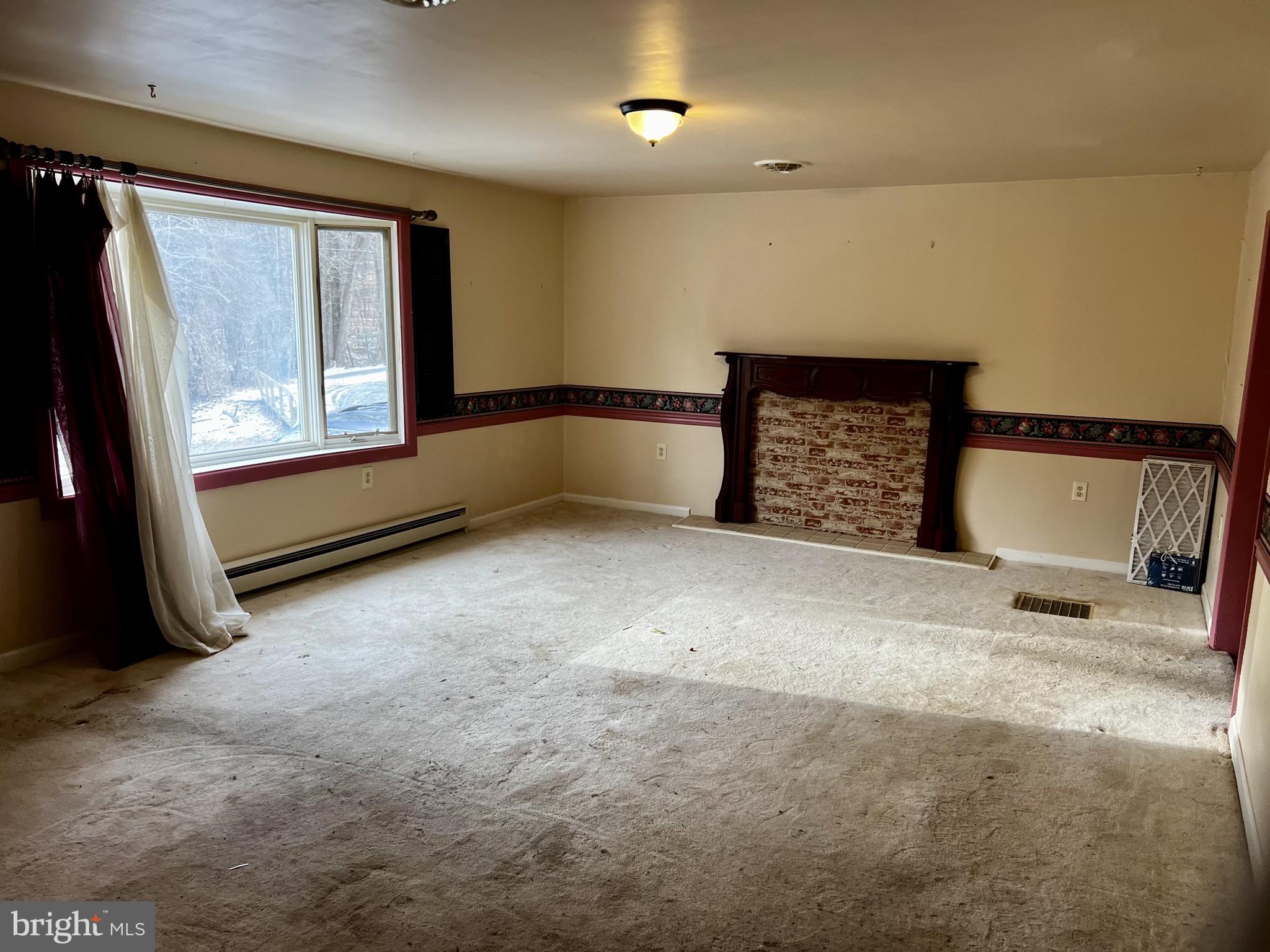 139 Carter Road Elkton, MD 21921 - Photo 4 of 27 a view of an empty room with windows