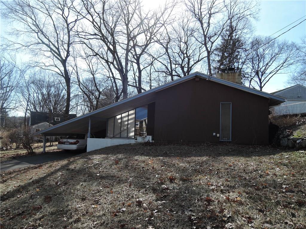 135 Seneca Road New Haven, CT 06515 - Photo 1 of 1 a view of garage with parked cars