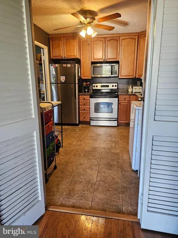 a view of a livingroom with furniture and hardwood floor