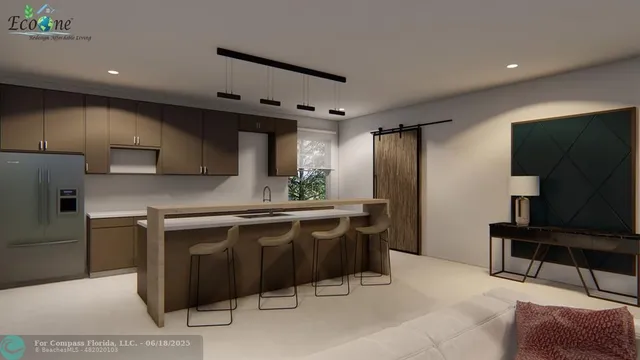 a kitchen with stainless steel appliances granite countertop a sink and a refrigerator