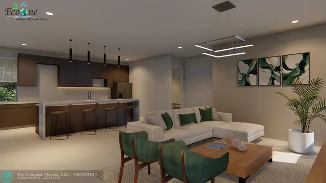 a living room with furniture and a kitchen