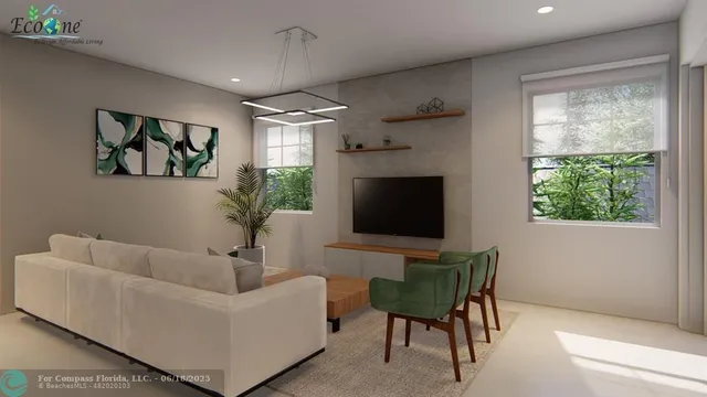 a kitchen with stainless steel appliances a sink a refrigerator a counter and chairs