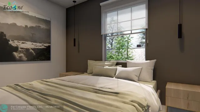 a bedroom with a bed and a painting on the wall