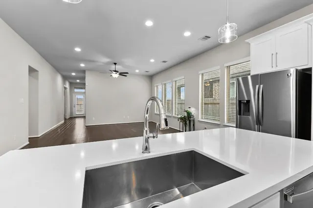a stove top oven sitting inside of a kitchen