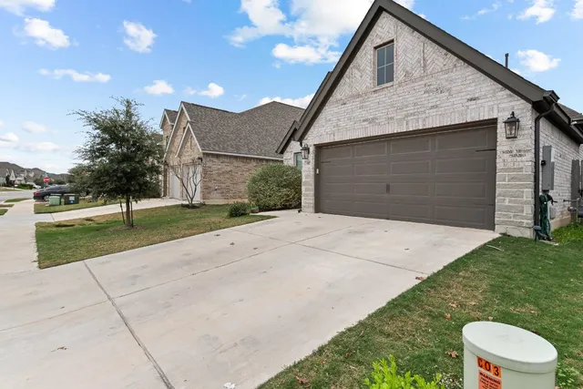 a view of a backyard of the house