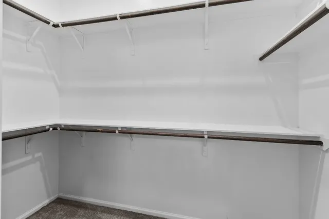 a bathroom with a shower sink and mirror