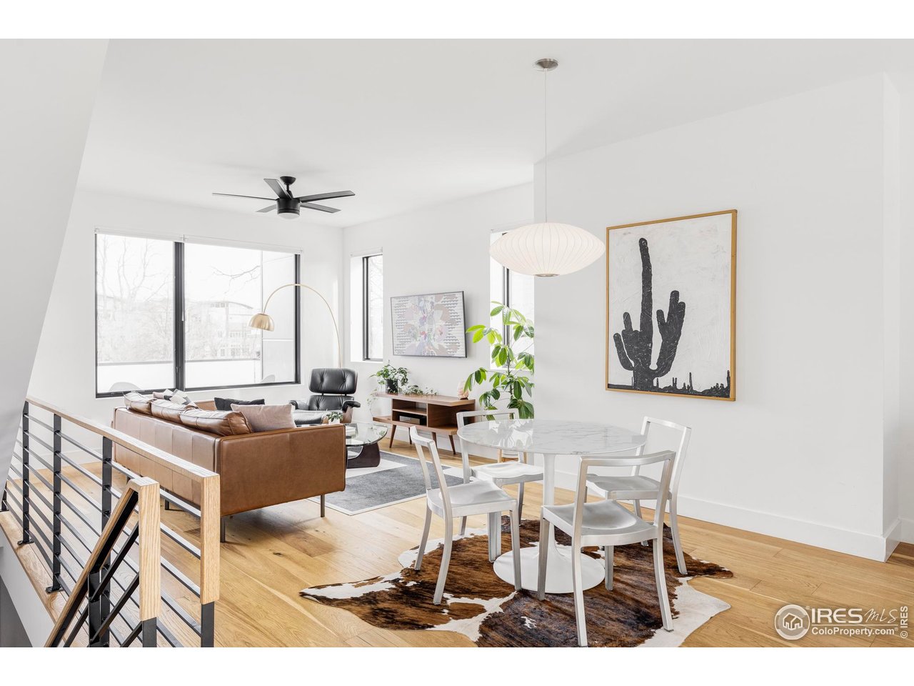 2465 Walnut Street, Unit 13 Boulder, CO 80302 - Photo 1 of 28 a living room with furniture and a large window