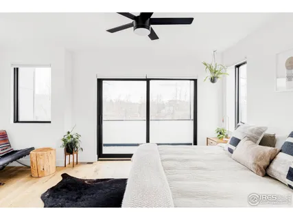 a living room with furniture and potted plant
