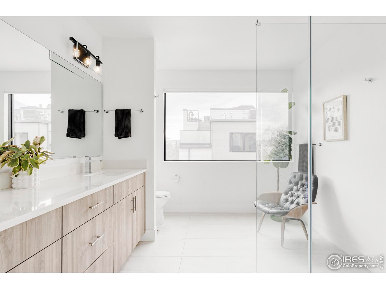 2465 Walnut Street, Unit 13 Boulder, CO 80302 - Photo 16 of 28 a bathroom with a sink and a mirror