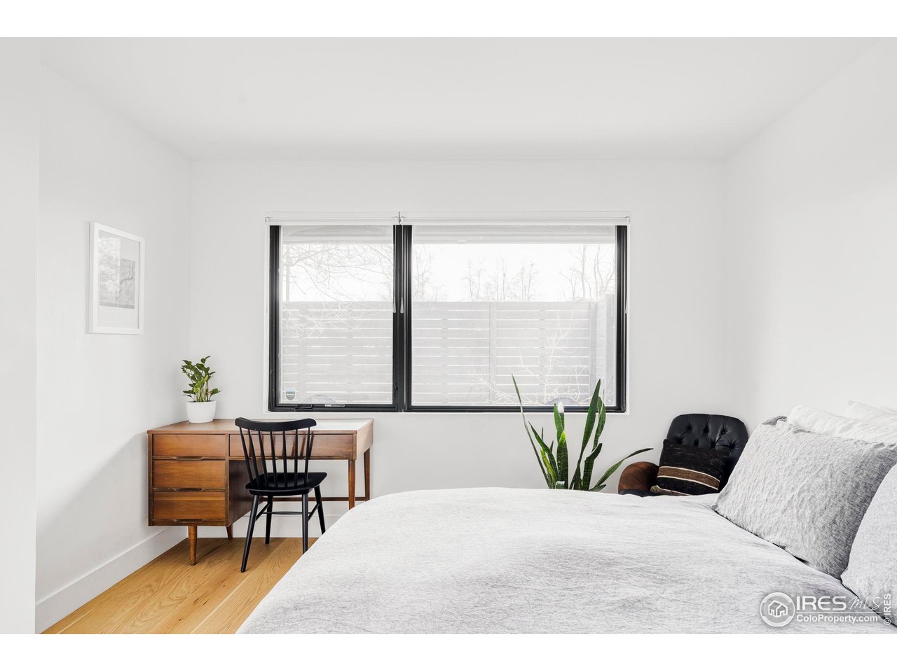 2465 Walnut Street, Unit 13 Boulder, CO 80302 - Photo 21 of 28 a bedroom with a bed and a window