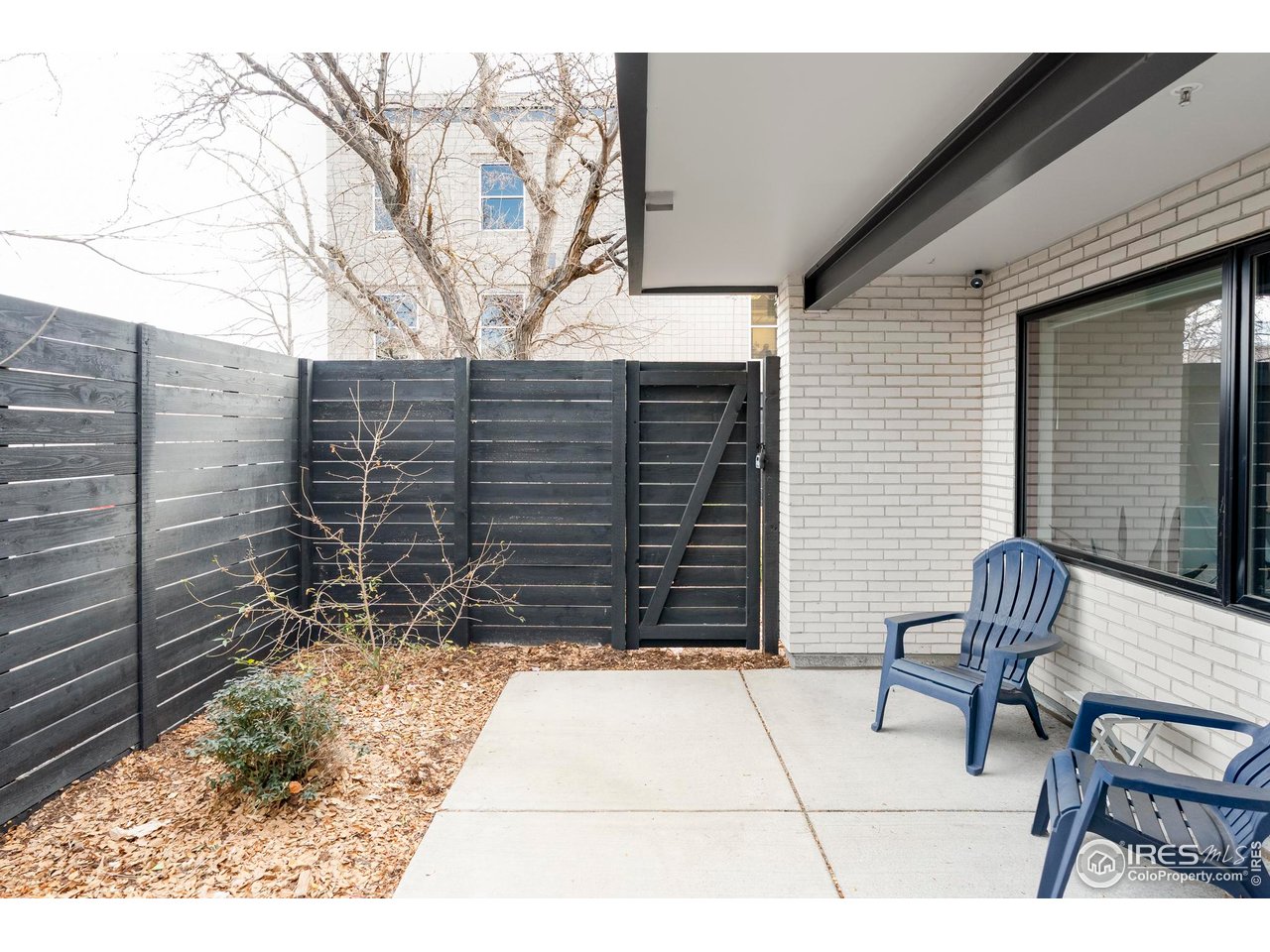 2465 Walnut Street, Unit 13 Boulder, CO 80302 - Photo 25 of 28 a view of house with backyard and sitting area