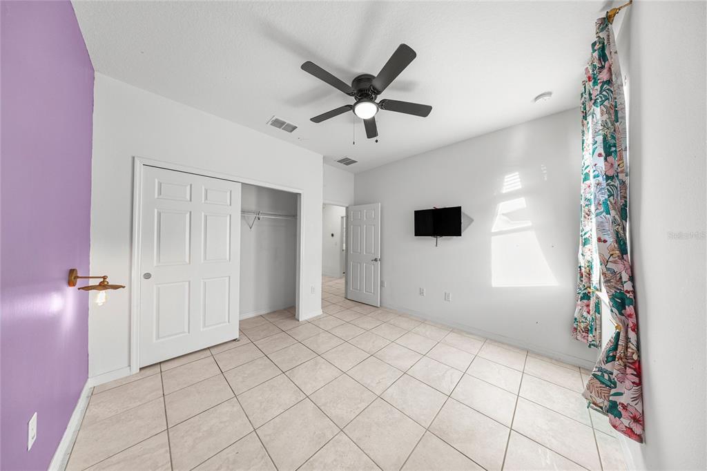 7664 Southwest 63rd Lane Road Ocala, FL 34474 - Photo 19 of 27 a view of a livingroom with a ceiling fan and window