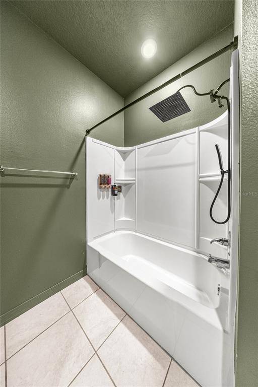 7664 Southwest 63rd Lane Road Ocala, FL 34474 - Photo 24 of 27 a bathroom with a bathtub and shower