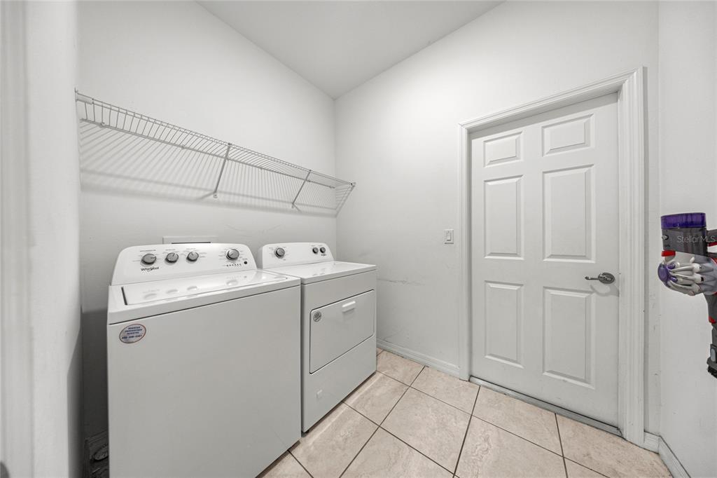 7664 Southwest 63rd Lane Road Ocala, FL 34474 - Photo 25 of 27 a utility room with dryer and washer