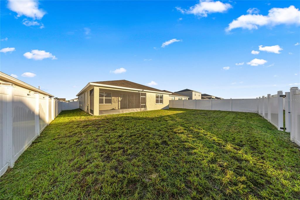 7664 Southwest 63rd Lane Road Ocala, FL 34474 - Photo 3 of 27 a front view of a house with a yard