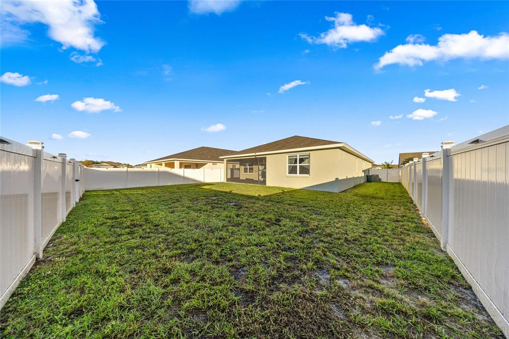 7664 Southwest 63rd Lane Road Ocala, FL 34474 - Photo 4 of 27 a view of a back yard of the house