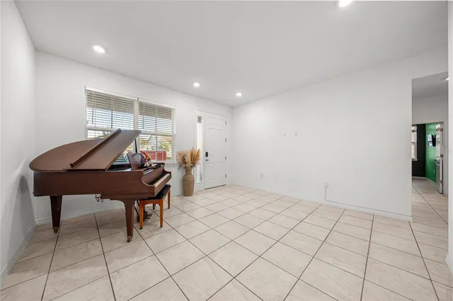 a kitchen with stainless steel appliances a refrigerator sink and microwave