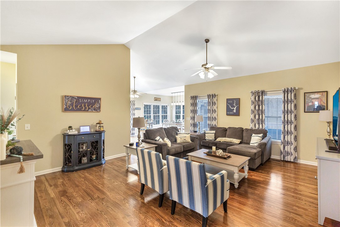 101 Riviera Circle Anderson, SC 29621 - Photo 6 of 35 This living area features a warm ambiance with rich wood flooring and ample natural light.