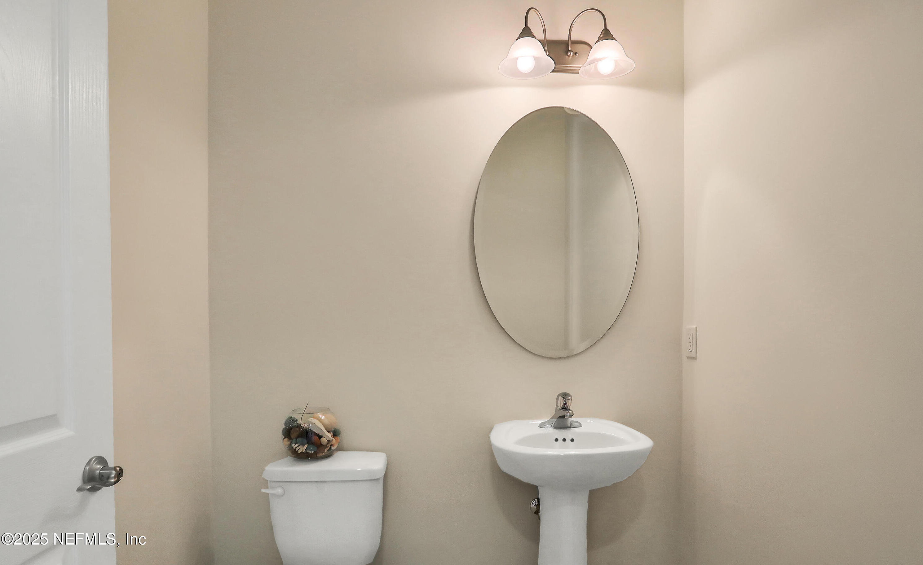634 Market Street St. Augustine, FL 32095 - Photo 8 of 13 a bathroom with a sink and a mirror