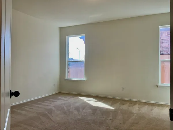 a view of an empty room and window