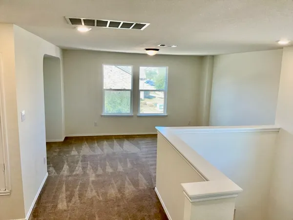 a view of an empty room and window