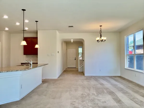 a view of a room with a chandelier