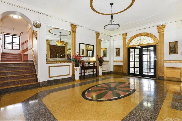 a living room with dining table and wooden floor