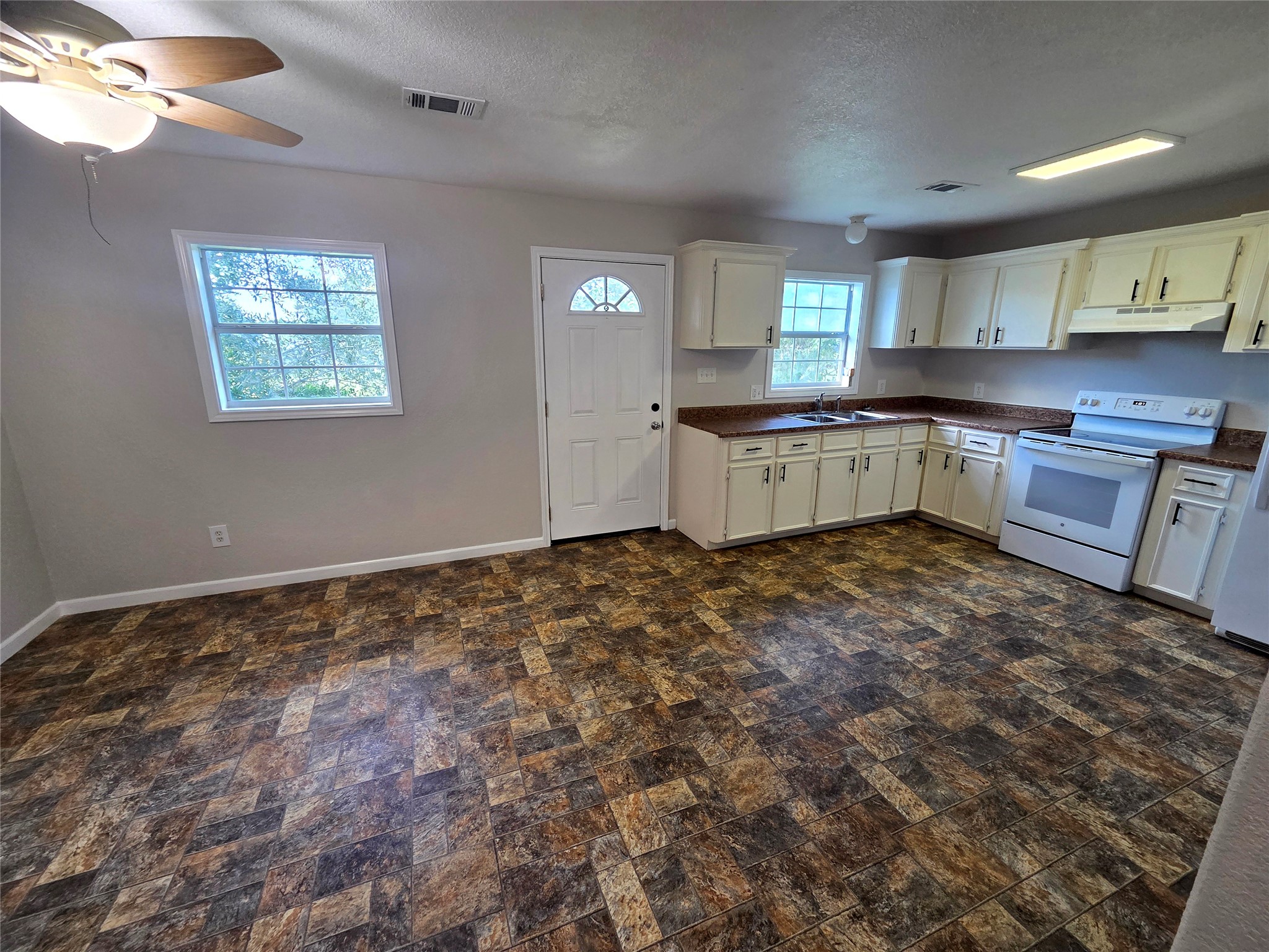 13632 Montgomery Road Santa Fe, TX 77510 - Photo 22 of 30 Kitchen/Living room with refrigerator and stove!
