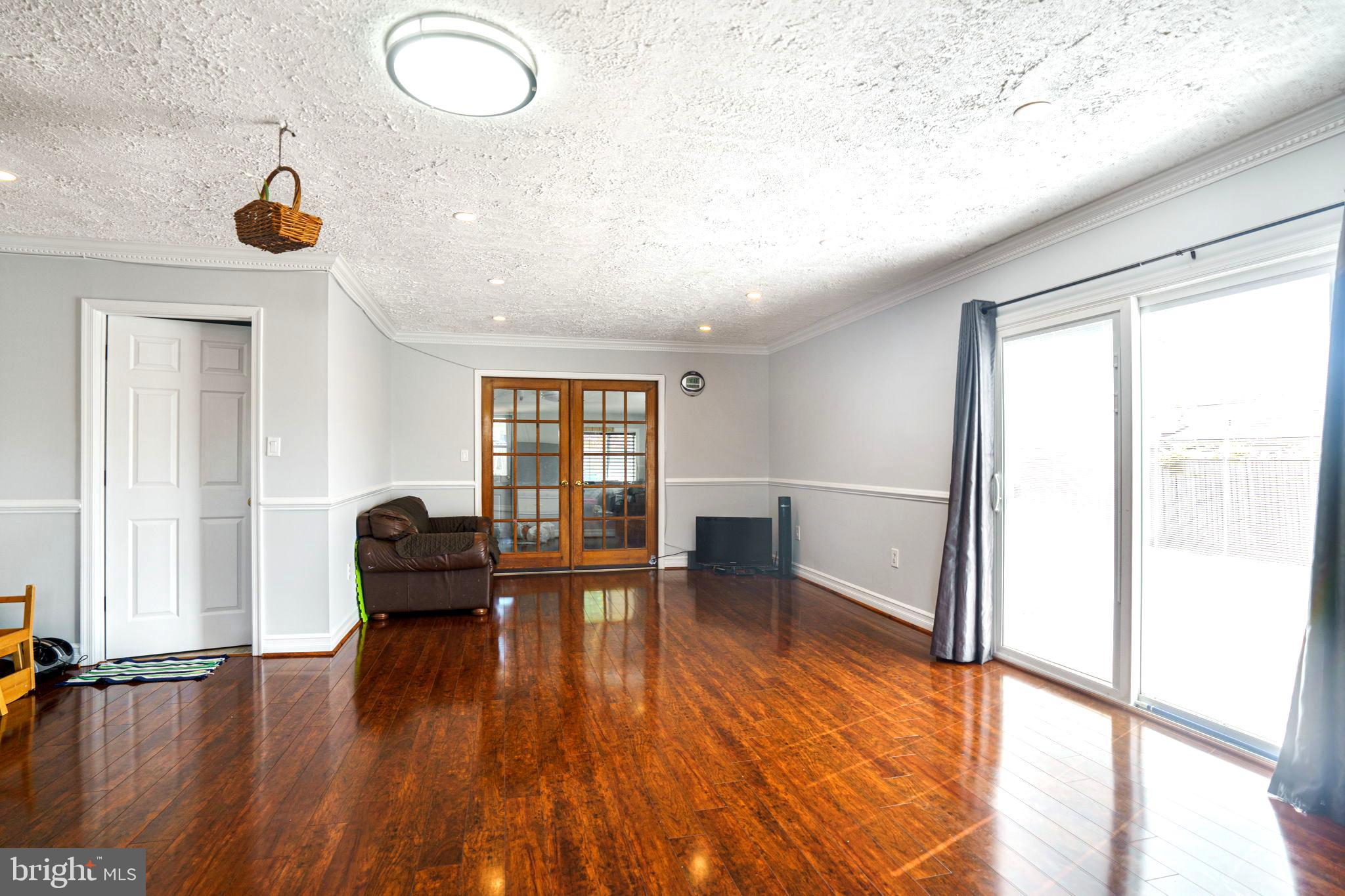 6204 Alamo Street Springfield, VA 22150 - Photo 13 of 44 Family room leads to the bonus room