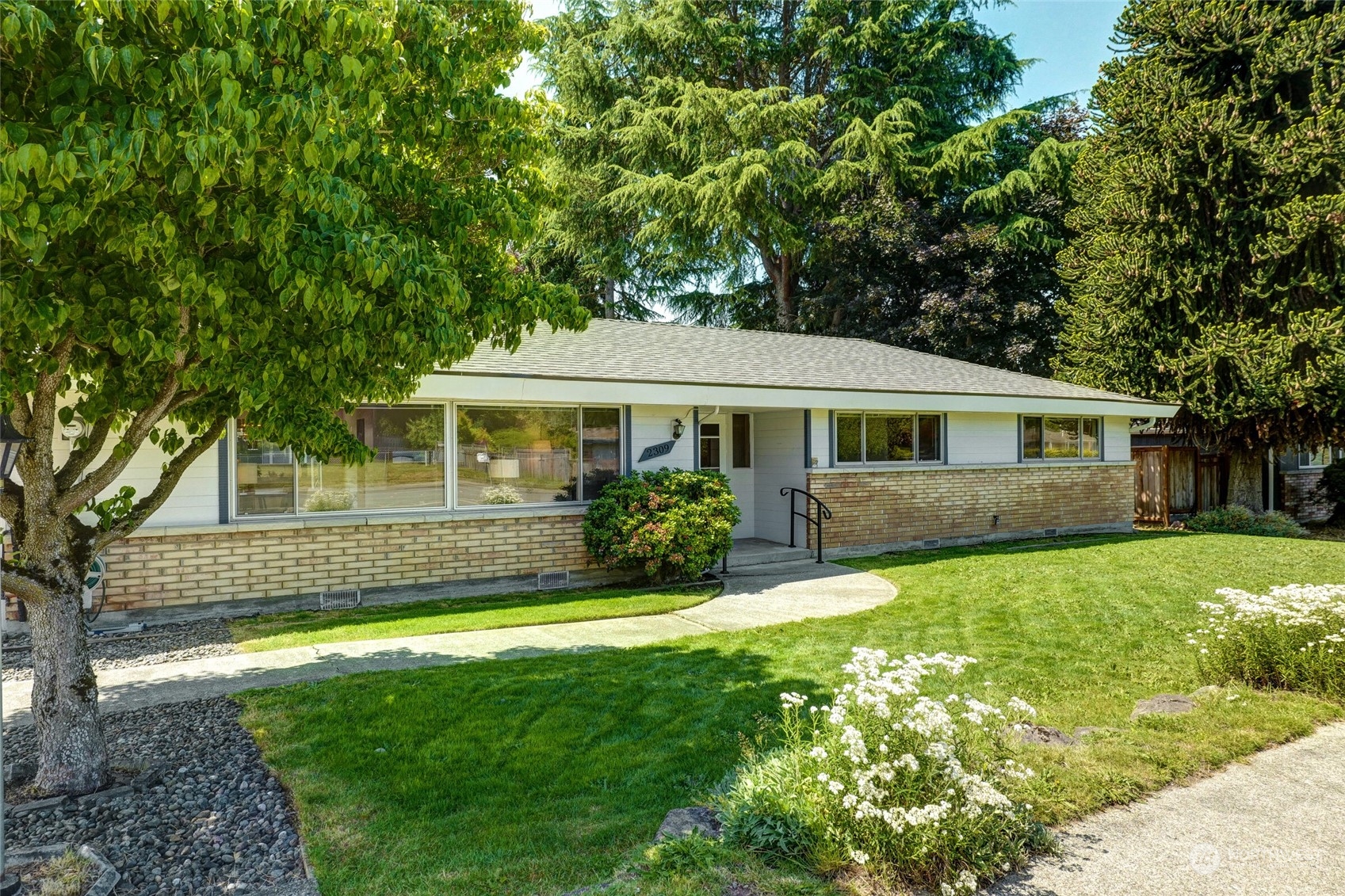 2309 Edmonds Avenue Northeast Renton, WA 98056 - Photo 1 of 35 a front view of a house with a yard