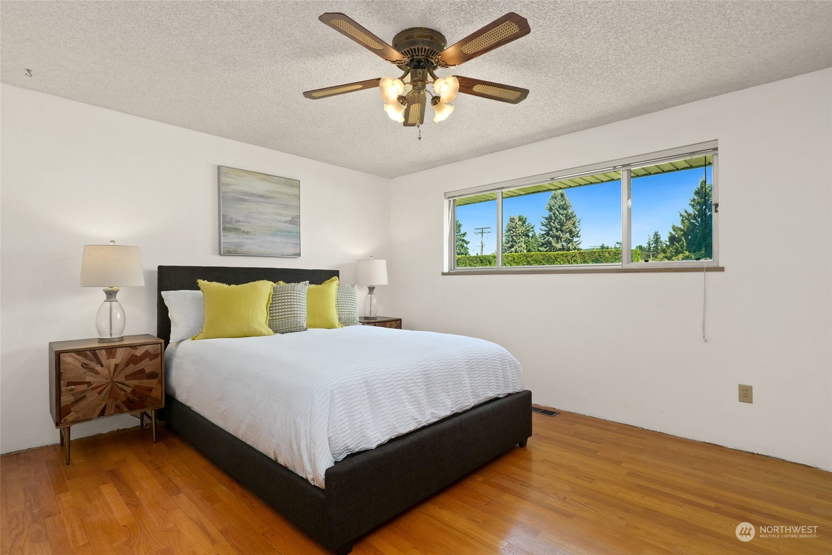 2309 Edmonds Avenue Northeast Renton, WA 98056 - Photo 13 of 35 a bedroom with a bed and a painting on the wall