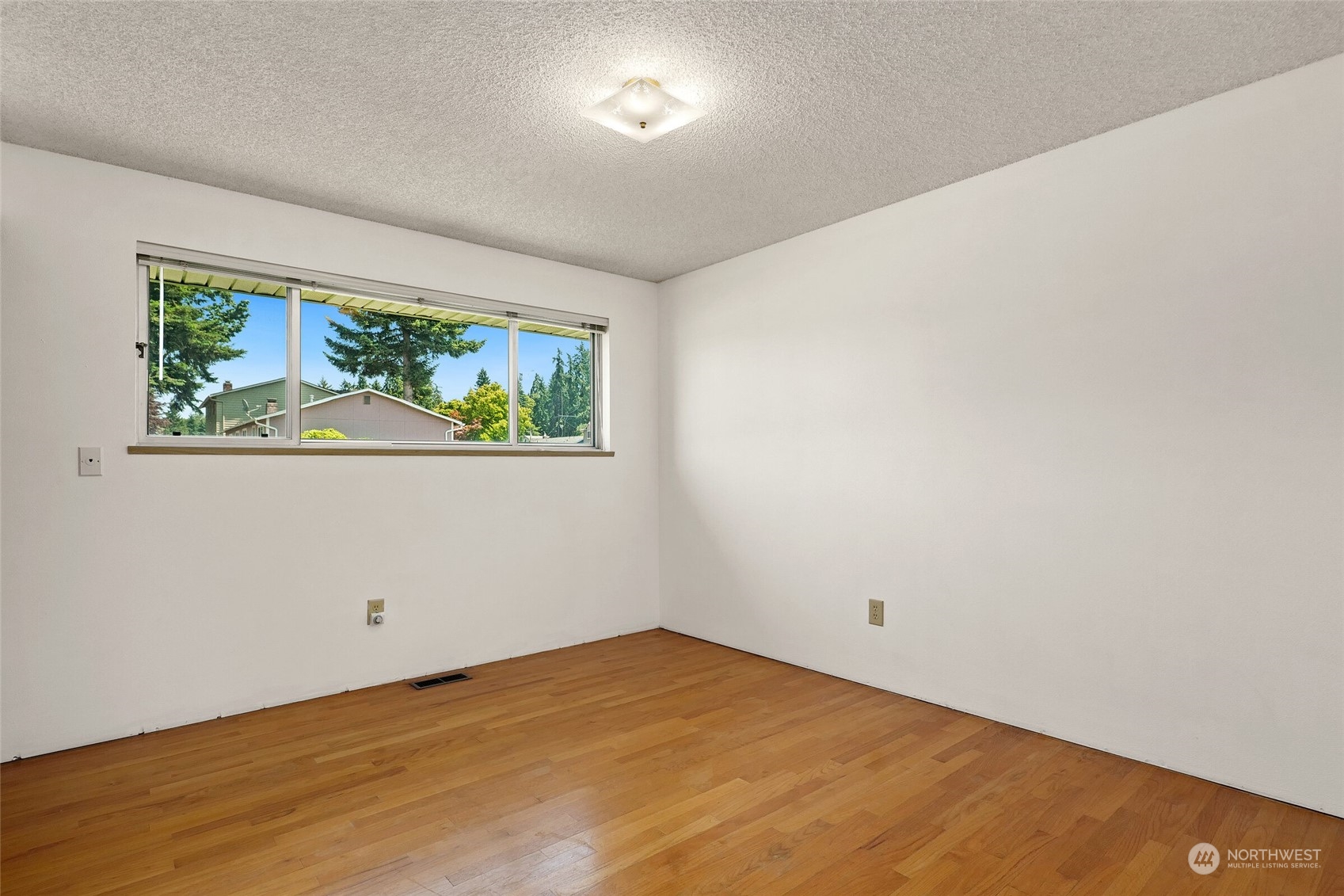 2309 Edmonds Avenue Northeast Renton, WA 98056 - Photo 15 of 35 an empty room with a window