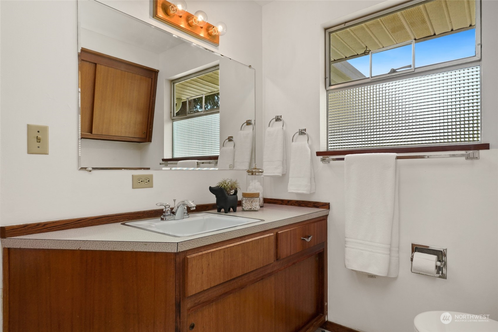 2309 Edmonds Avenue Northeast Renton, WA 98056 - Photo 16 of 35 a bathroom with a sink and a mirror