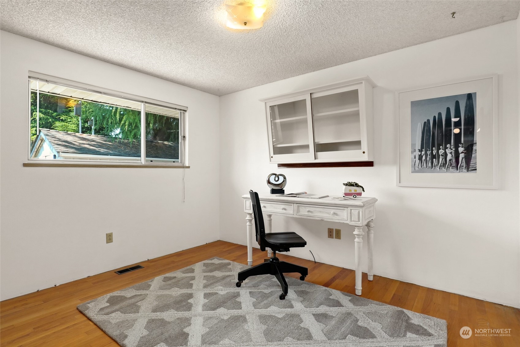2309 Edmonds Avenue Northeast Renton, WA 98056 - Photo 17 of 35 a view of a workspace with furniture and a window