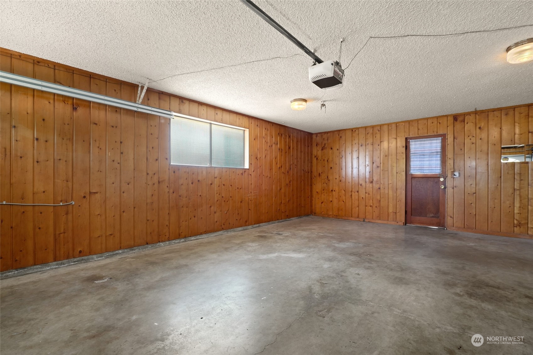 2309 Edmonds Avenue Northeast Renton, WA 98056 - Photo 19 of 35 an empty room with windows and closet area