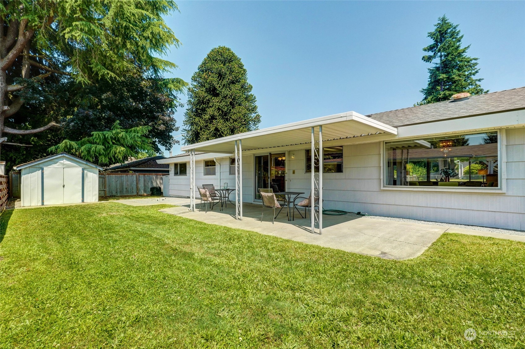 2309 Edmonds Avenue Northeast Renton, WA 98056 - Photo 24 of 35 a backyard of a house with table and chairs